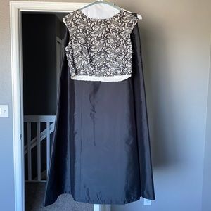 This Aidan Mattox two-piece dress is perfect for prom!! It is black and white!